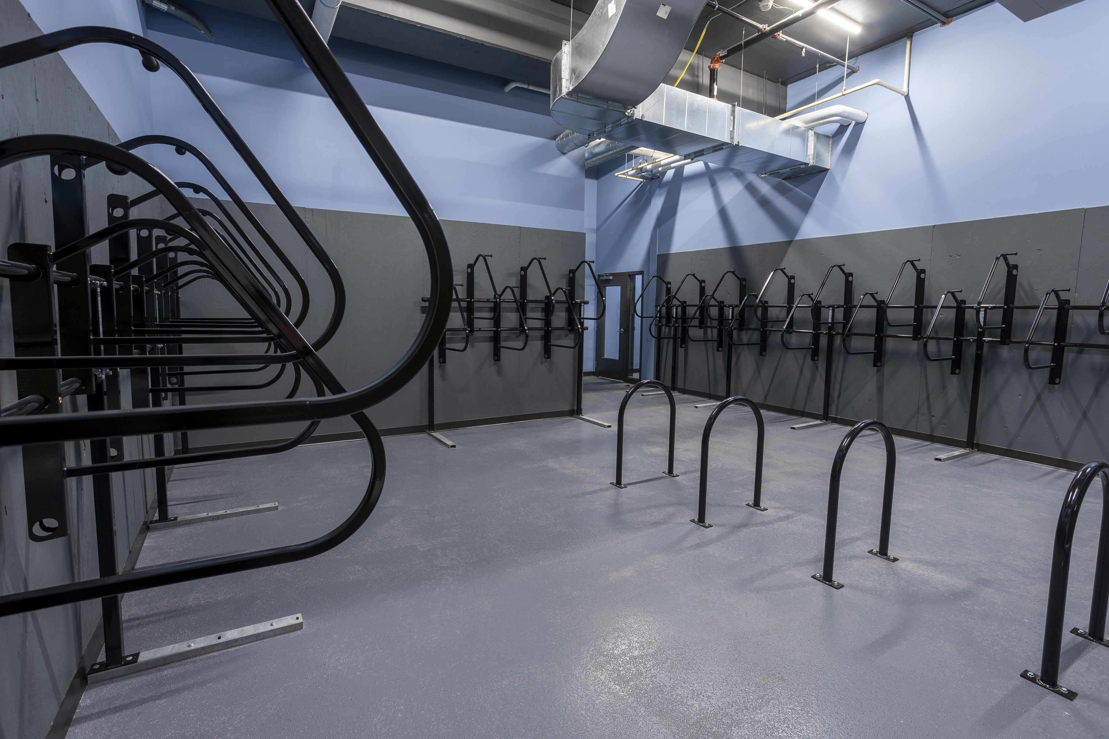 Spacious bike room with plenty of racks for storage