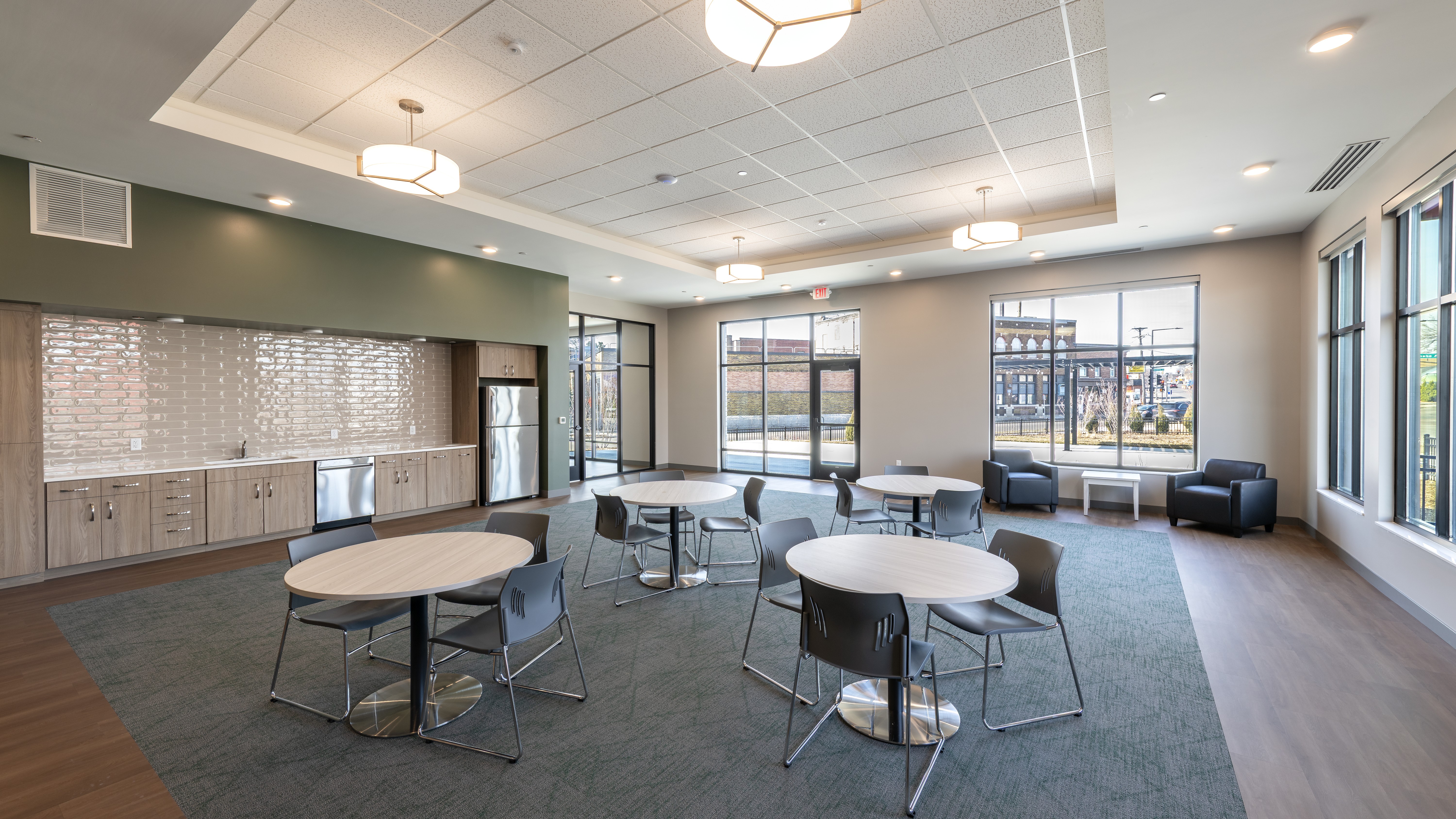 Large room with kitchenette and tables and chairs