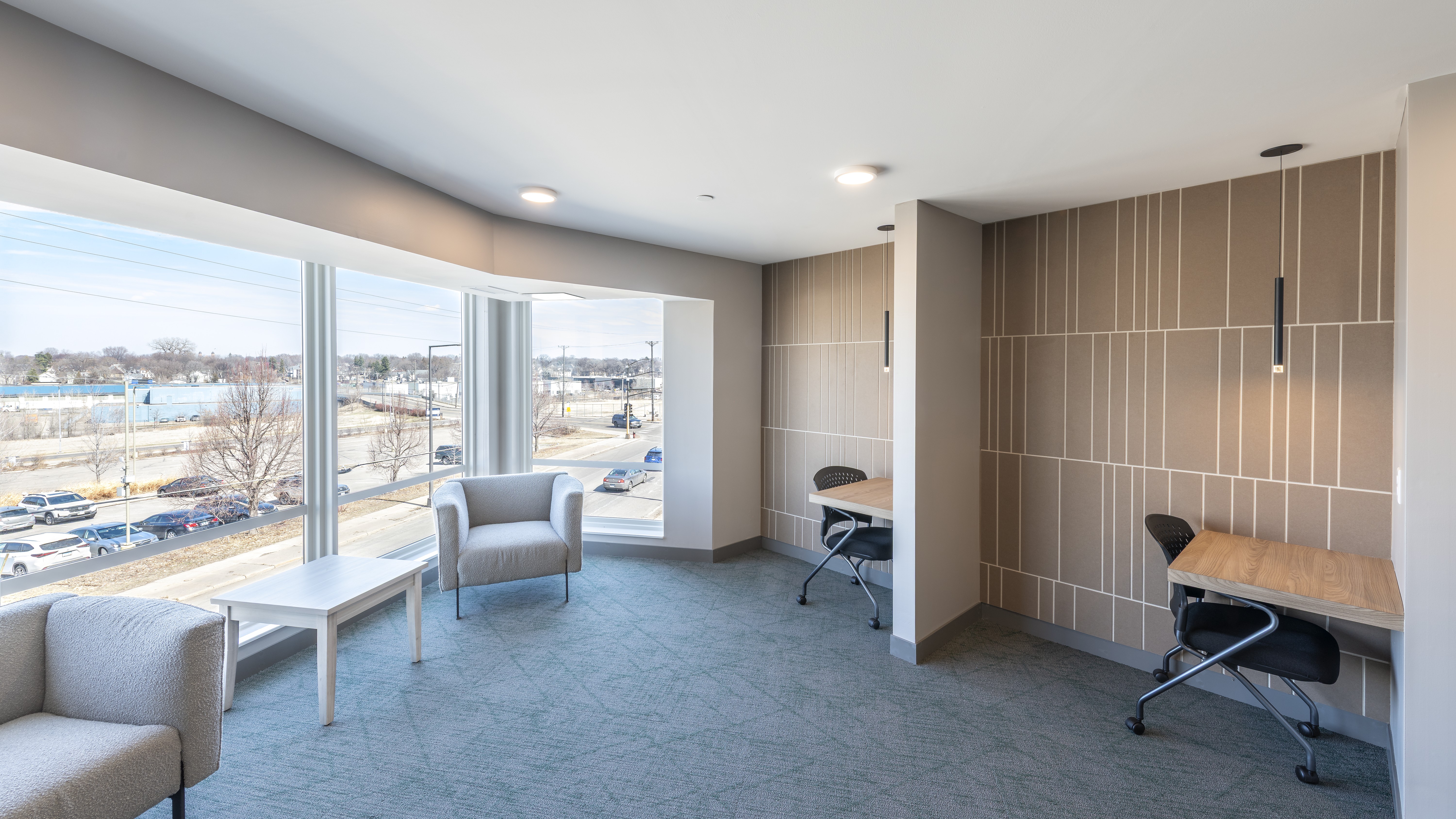Spacious room with individual desks and lounge chairs