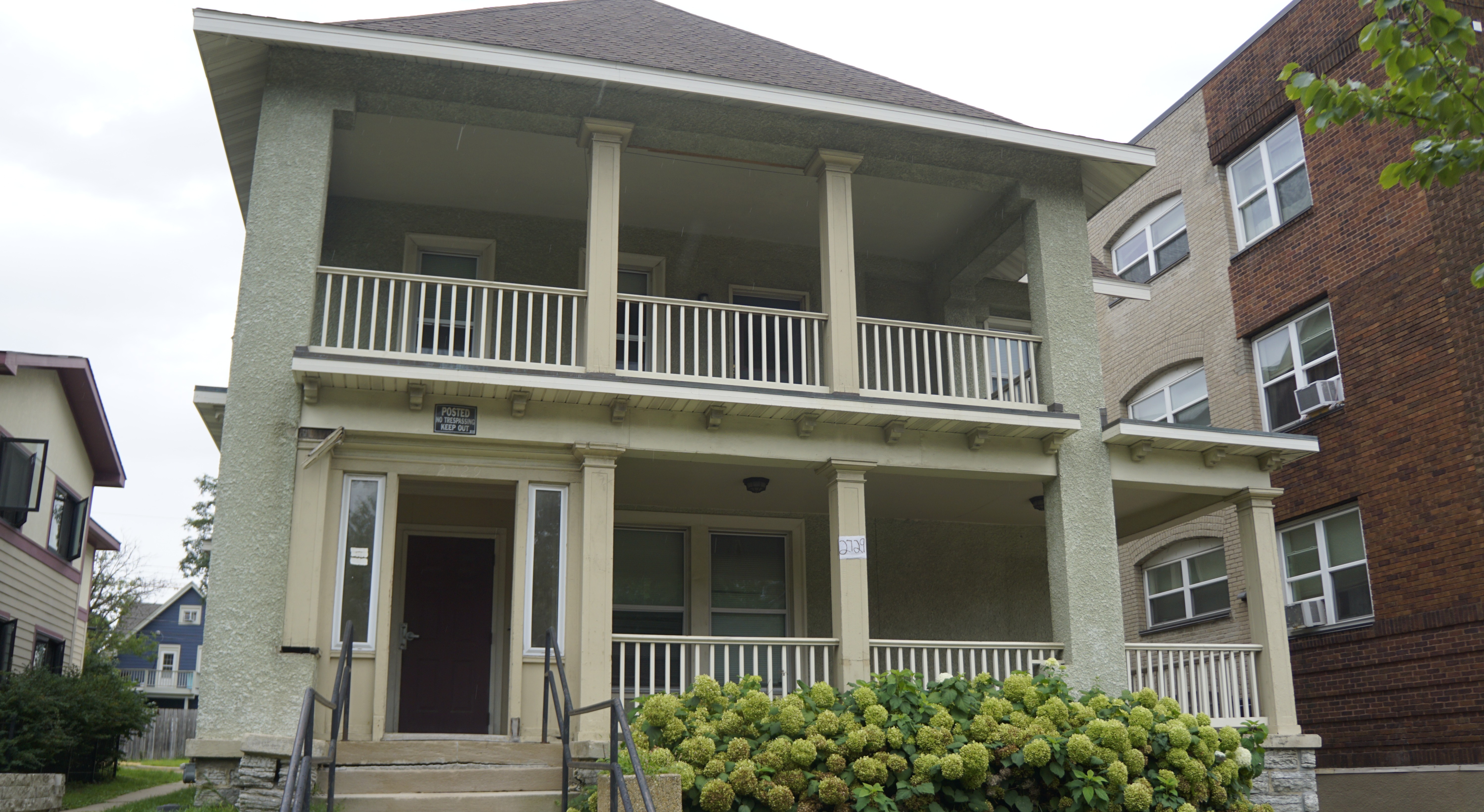 Two story home with light green exterior