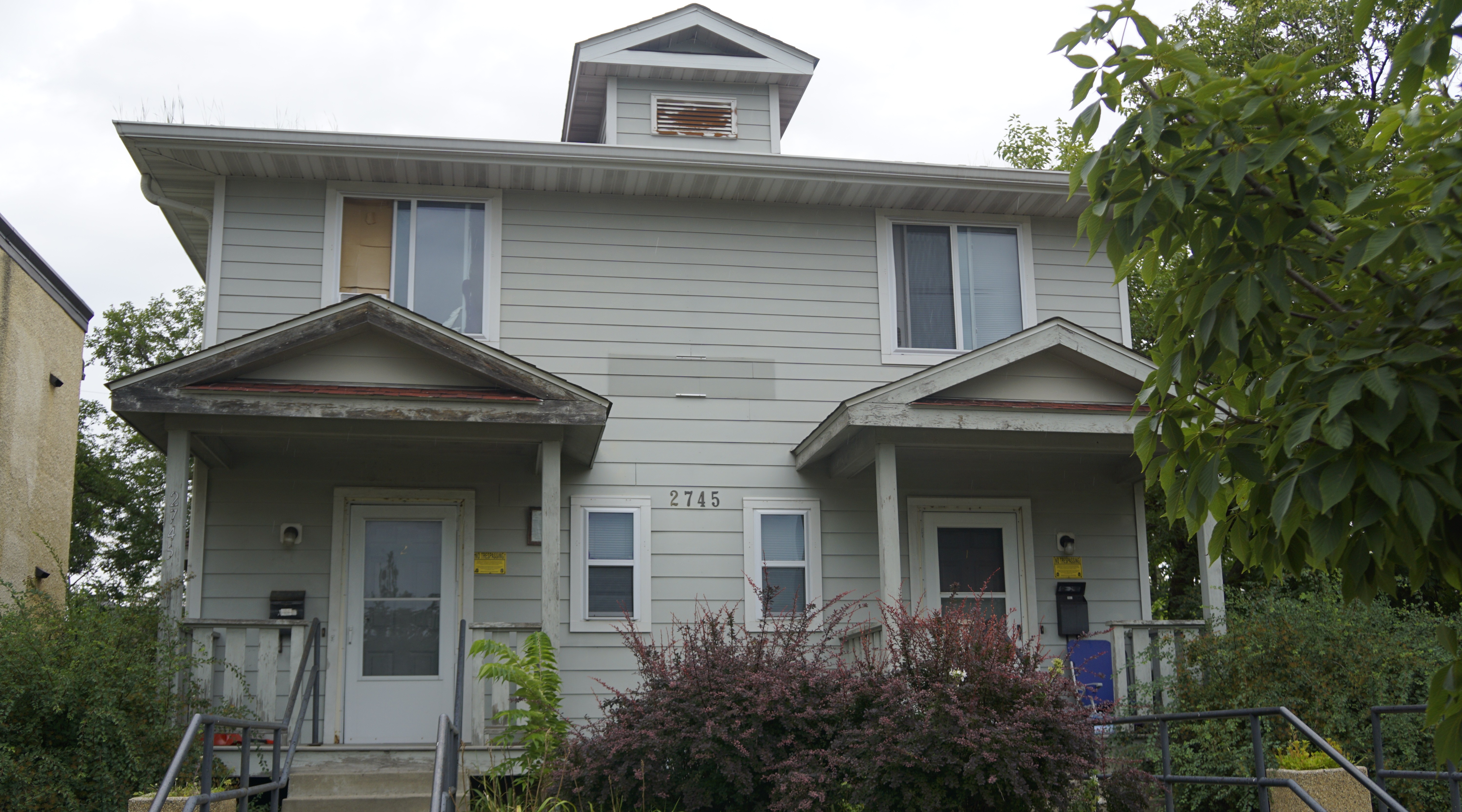 Two story property with light gray exterior