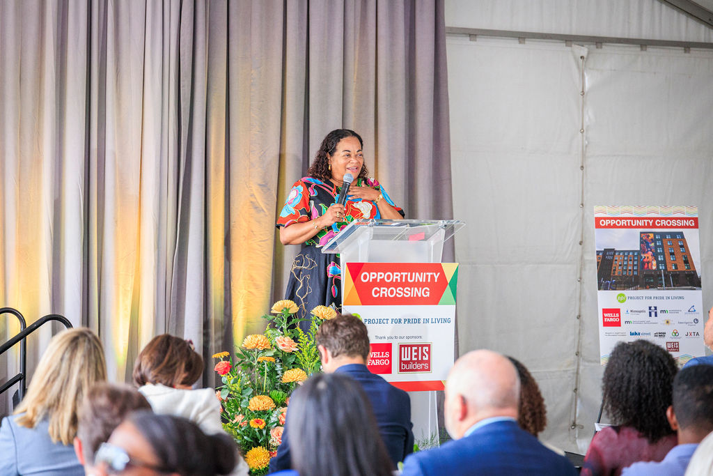 Karla Henderson, president and chief executive officer of Minneapolis-based Project for Pride in Living, speaks during the grand opening of Opportunity Crossing. 