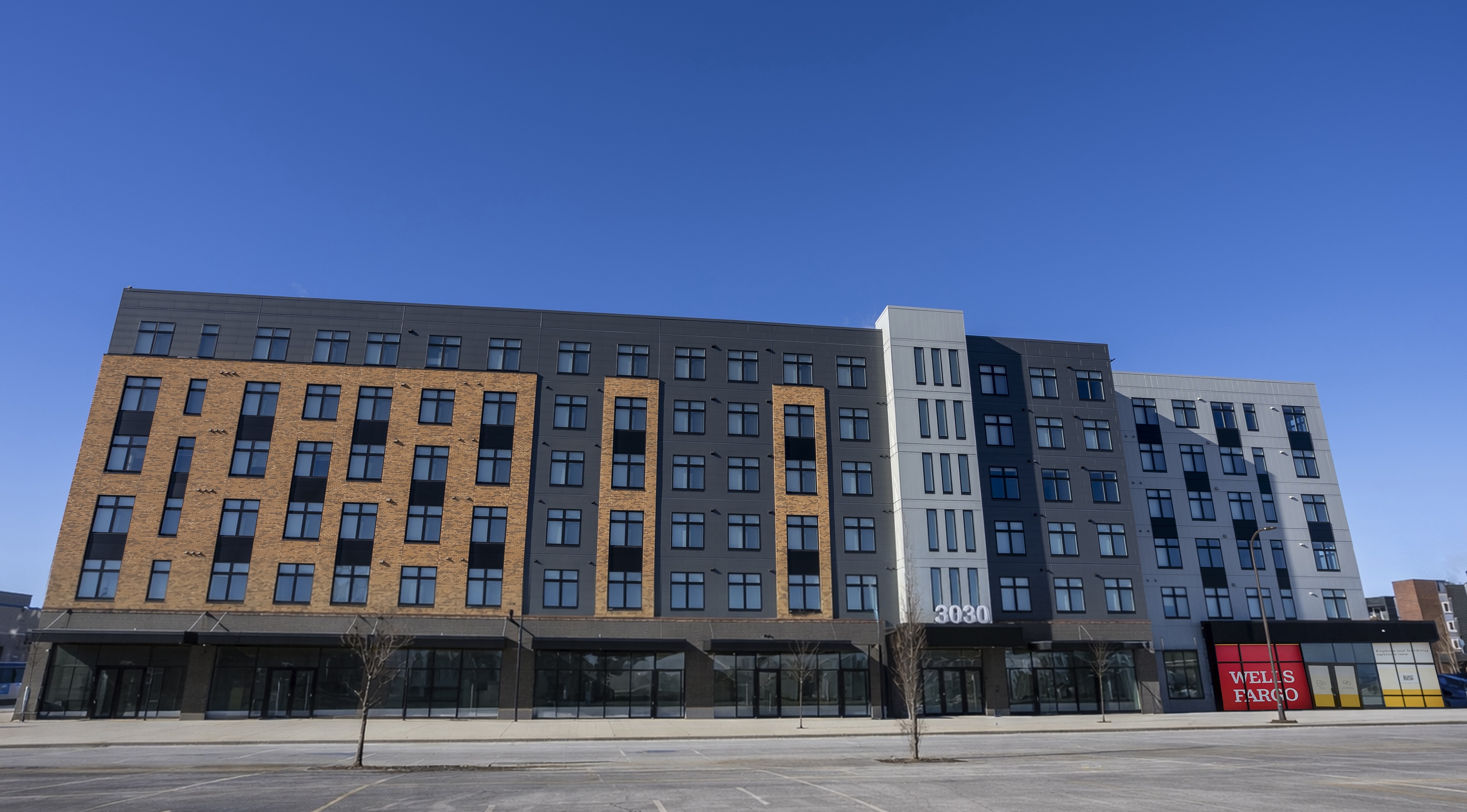 exterior image of opportunity crossing property building - six floors and 110 units