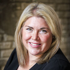 Woman in a black shirt smiling