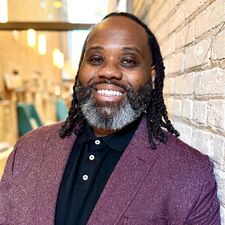 Man in suit and smiling