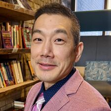 Man in suit and tie smiling