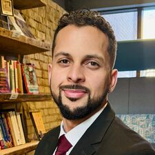 Man in suit and tie smiling
