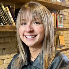 Woman sitting and smiling