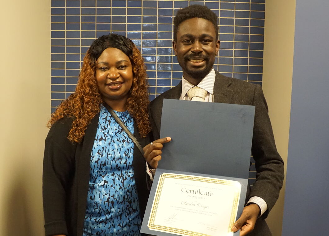 Charles Osugo with his mother at graduation