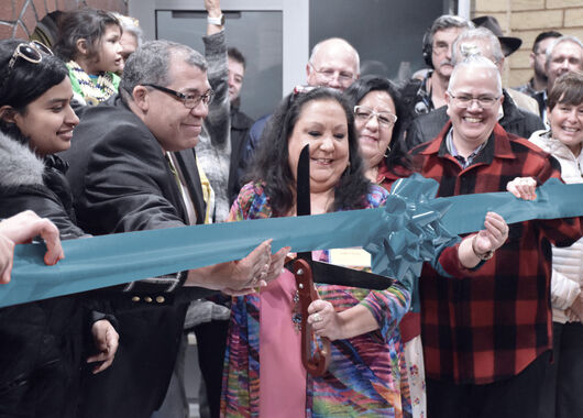 crowd attending a ribbon cutting