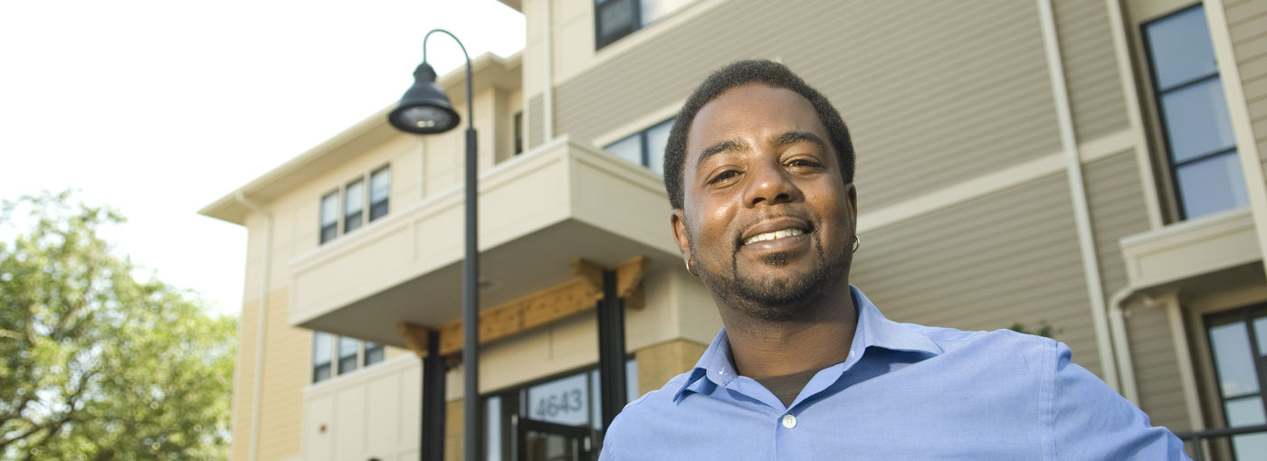 Man outside apartment building