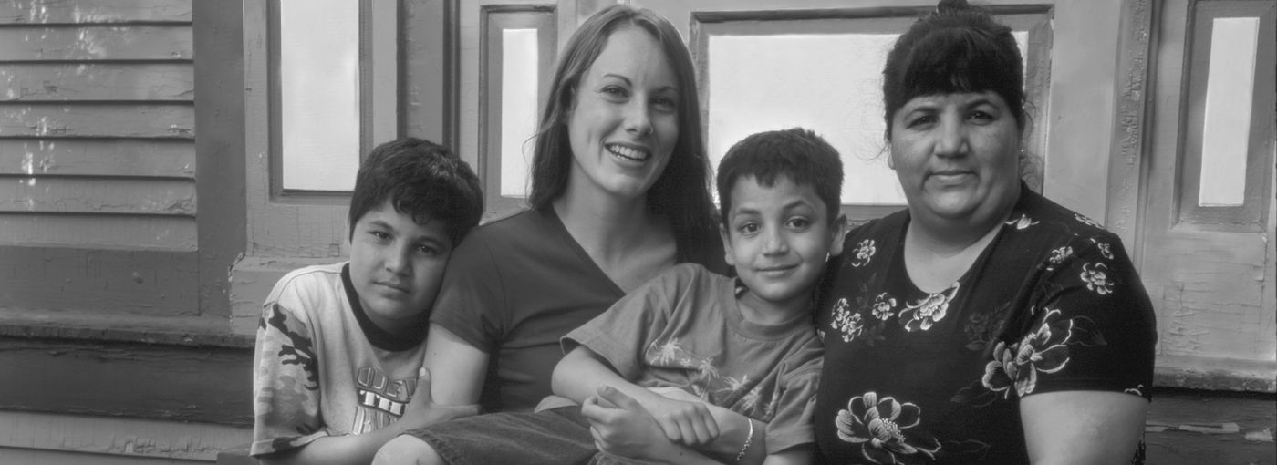 Family in front of house