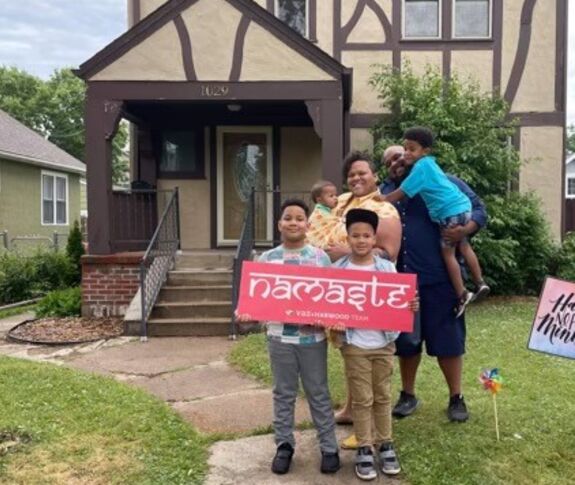 Family outside their new home