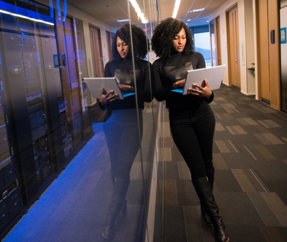 Woman Standing with Laptop