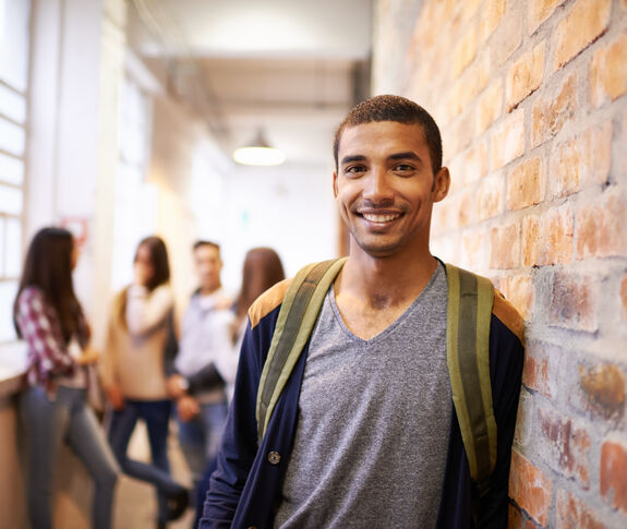 college age man with backpack
