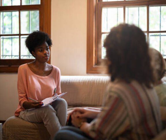 Woman speaking with clients