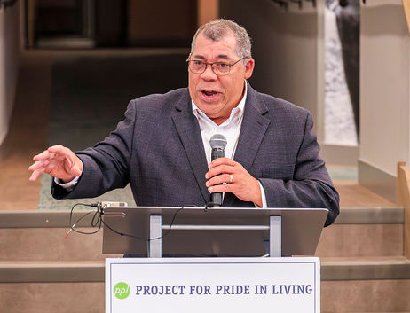 Paul Williams speaking at podium