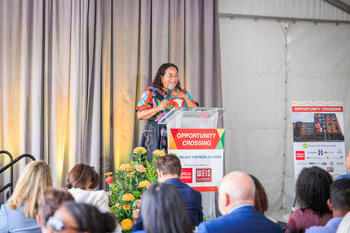 Karla Henderson, president and chief executive officer of Minneapolis-based Project for Pride in Living, speaks during the grand opening of Opportunity Crossing. 