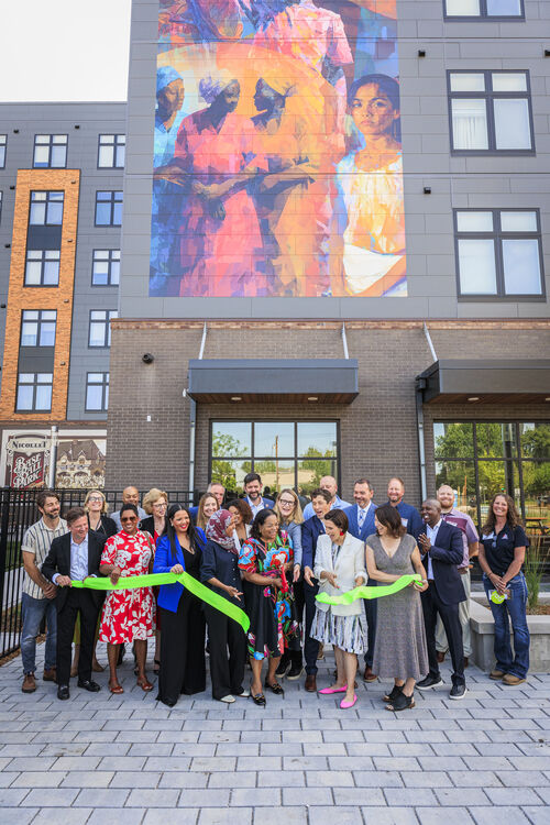 A photo of a ribbon cutting in front of Opportunity Crossing