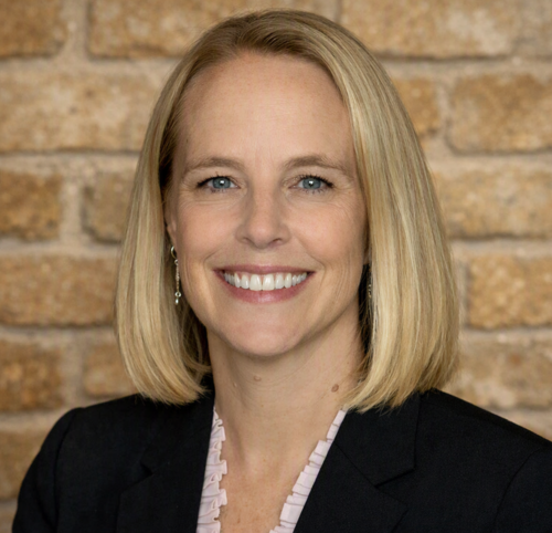 A professional headshot of Britta Reitan