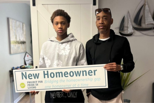 NEW HOME OWNER MICHAEL SHELTON WITH HIS SON MYLES