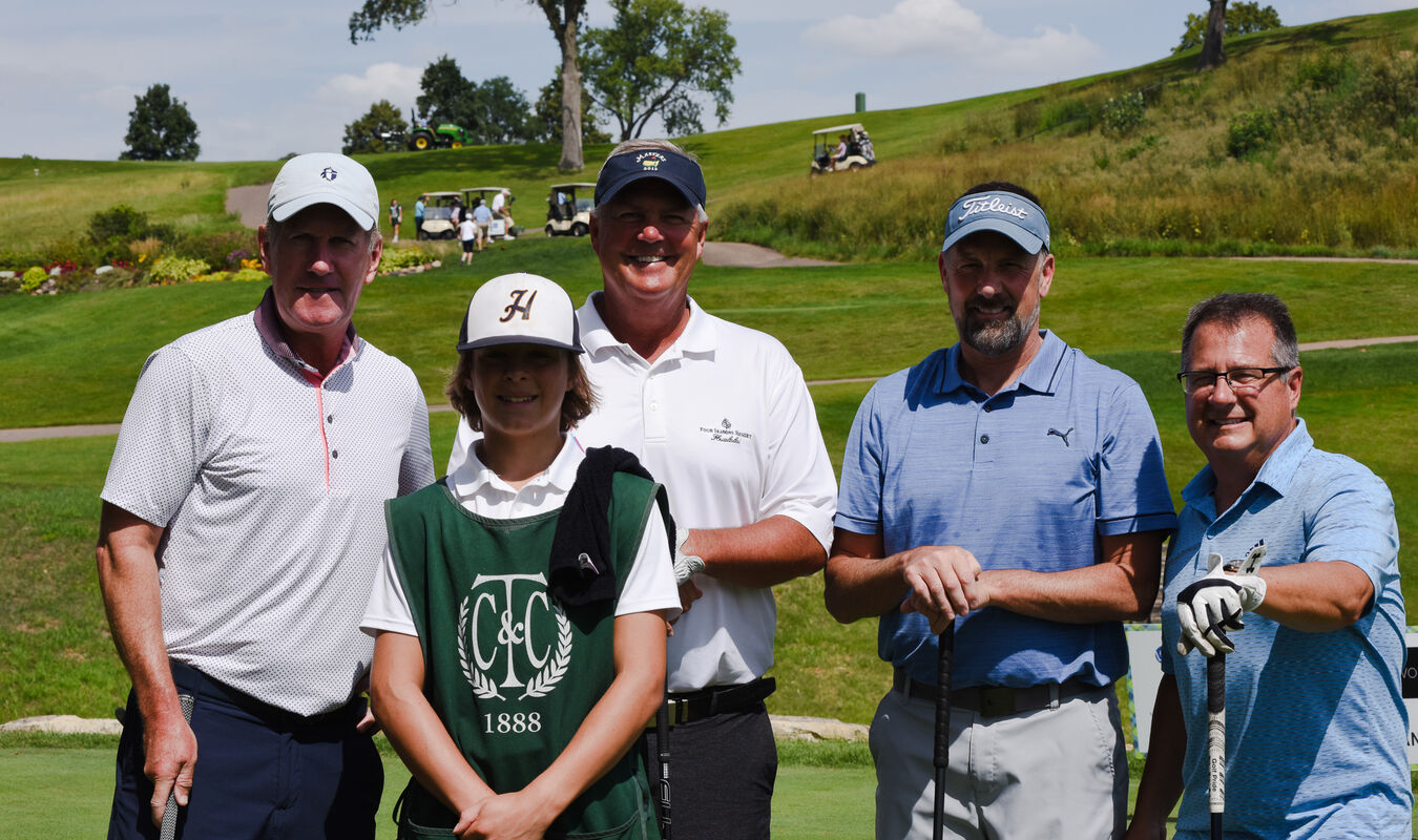 foursome and caddy