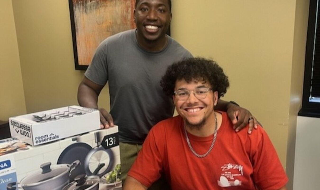 Two men smiling after closing on new property