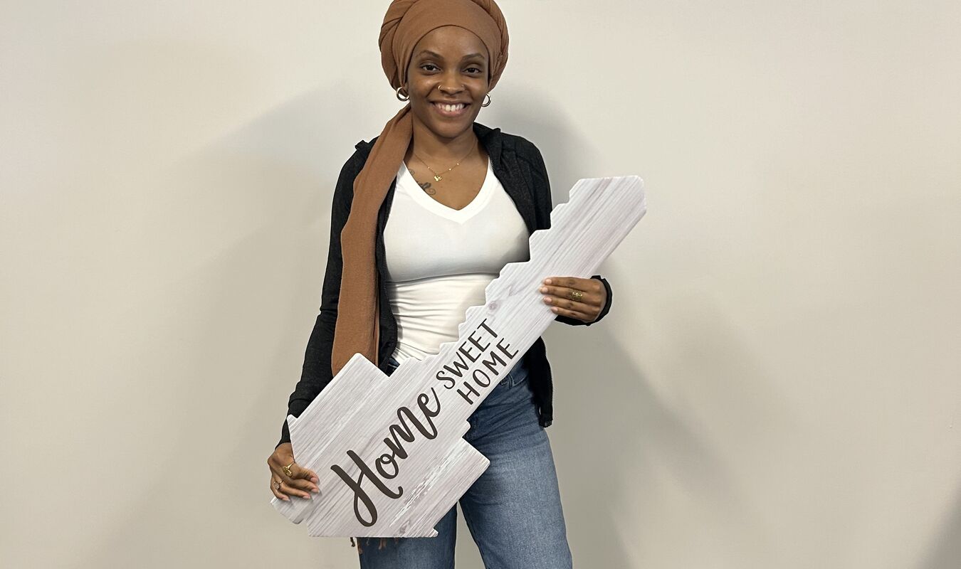 Woman smiling after closing on new home