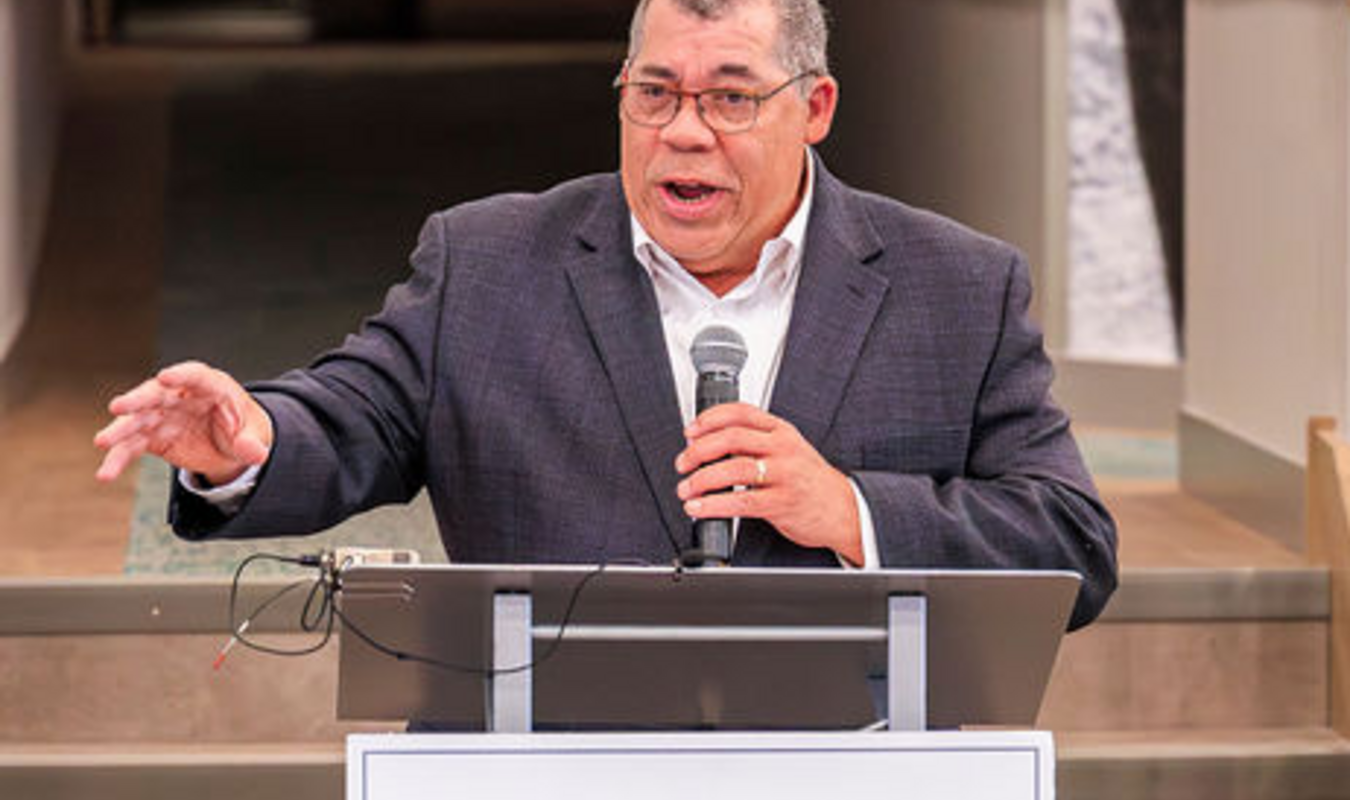 Paul Williams speaking at podium