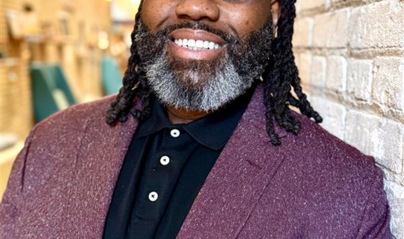 Man in a suit smiling