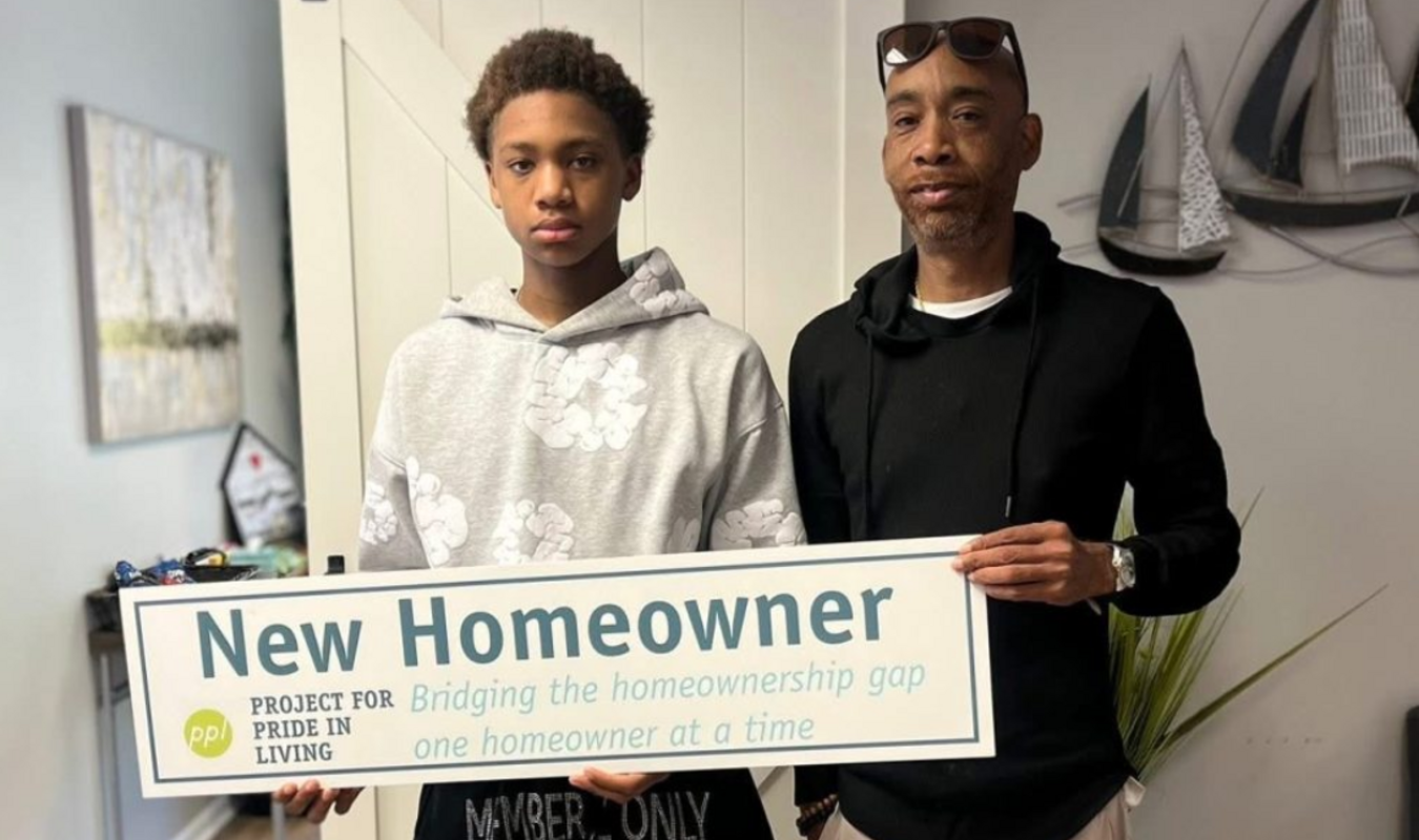NEW HOME OWNER MICHAEL SHELTON WITH HIS SON MYLES