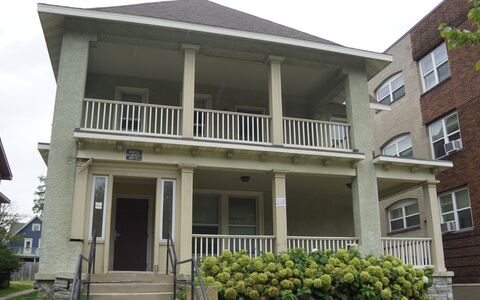 Two story home with light green exterior