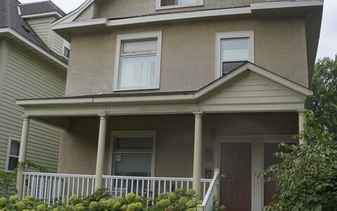 Two story home with tan exterior