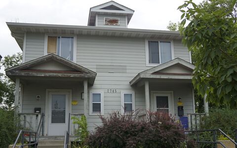 Two story property with light gray exterior