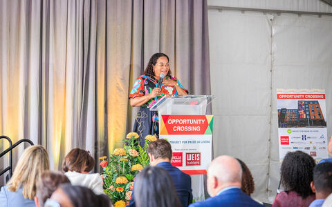 Karla Henderson, president and chief executive officer of Minneapolis-based Project for Pride in Living, speaks during the grand opening of Opportunity Crossing. 