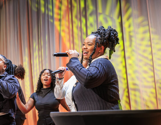 Choir singing on stage at PPL Breakfast